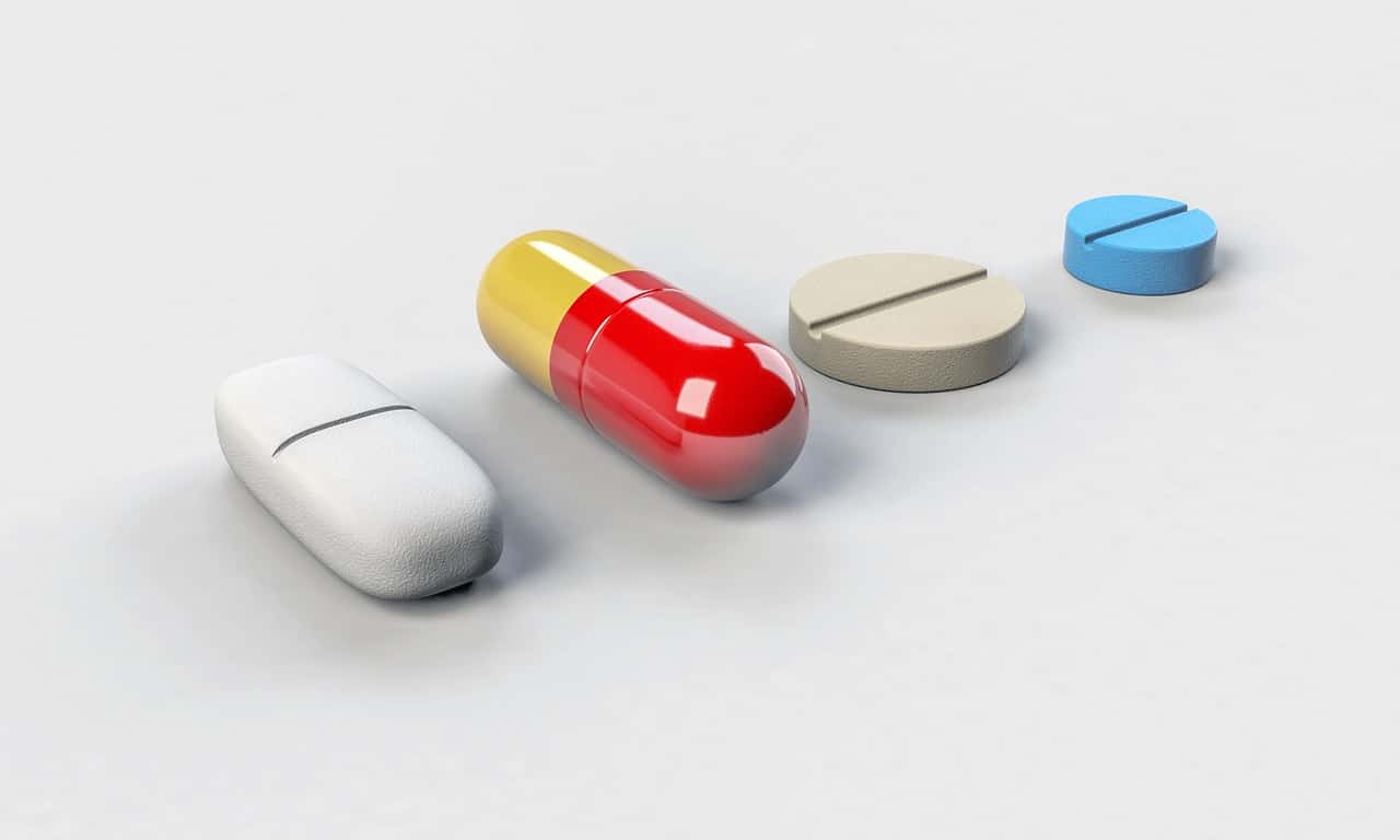 A line of different antibiotics on a white table.