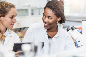 Two pharmacy students working together in lab