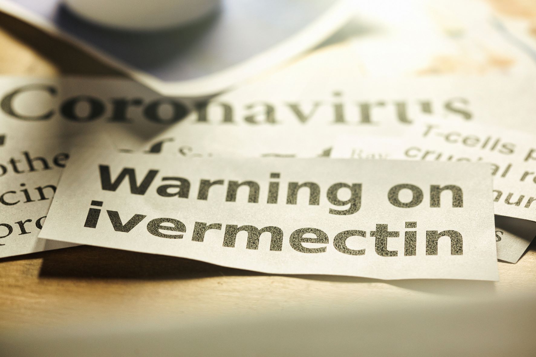 Cut out news clip articles with titles of ivermectin poisoning.