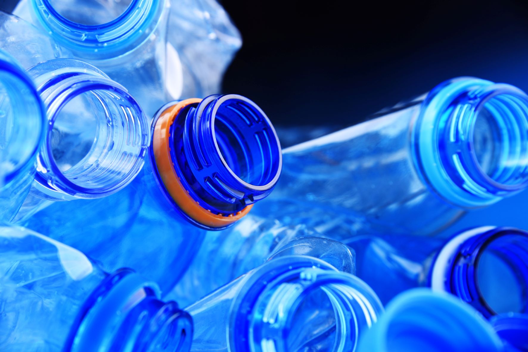 plastic water bottles sitting on one another.