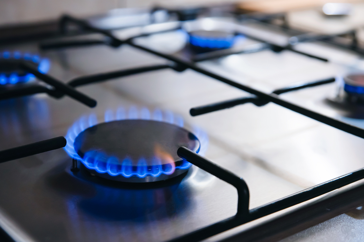 Gas stove burner with blue flame lit