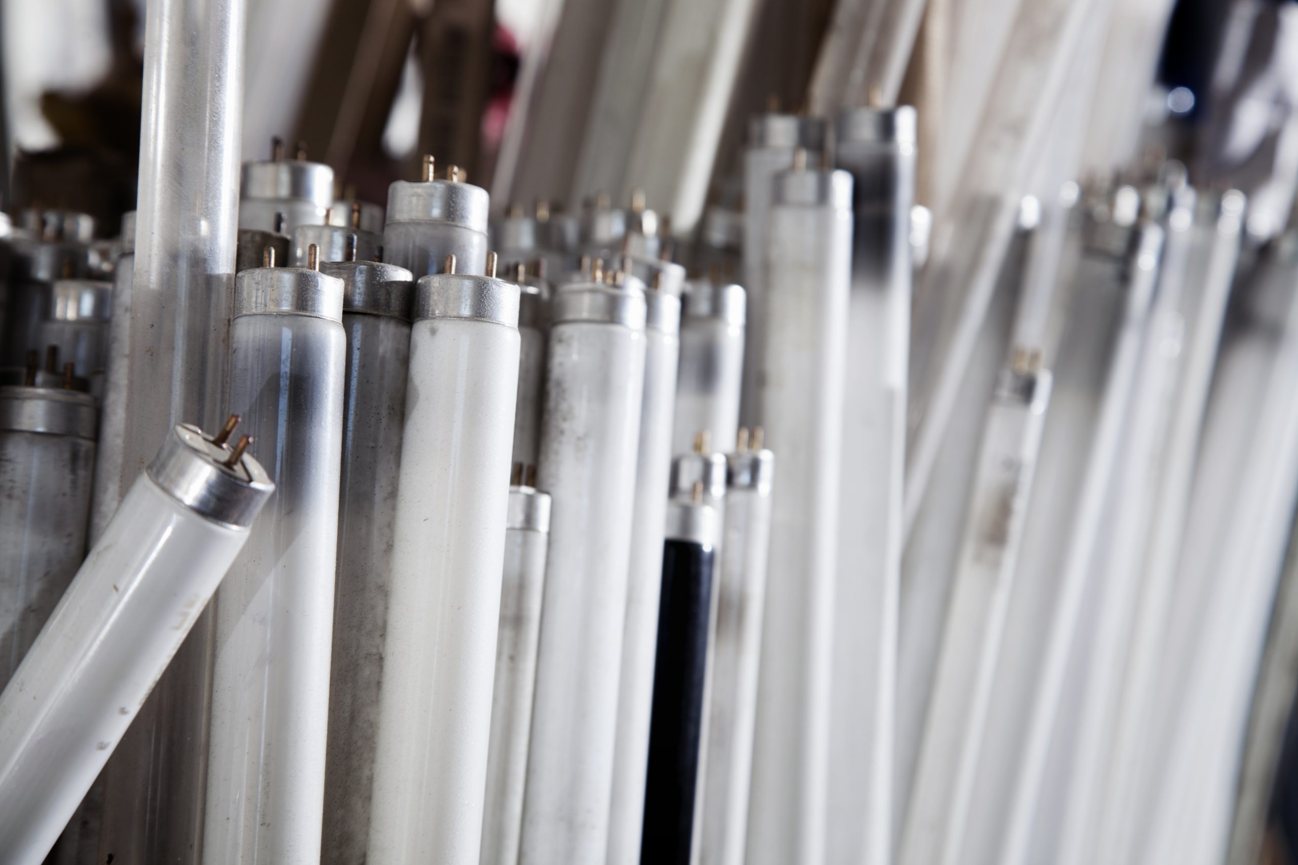A stack of fluorescent light bulbs