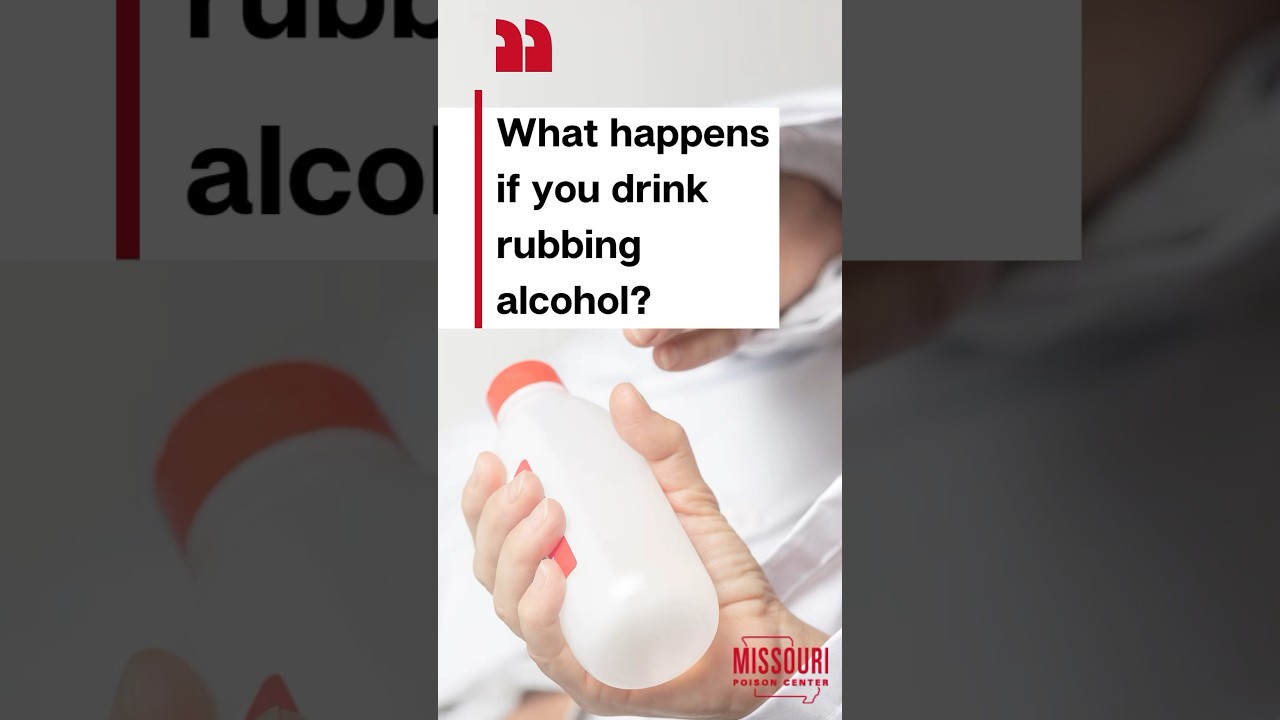 Human hand holding bottle of rubbing alcohol
